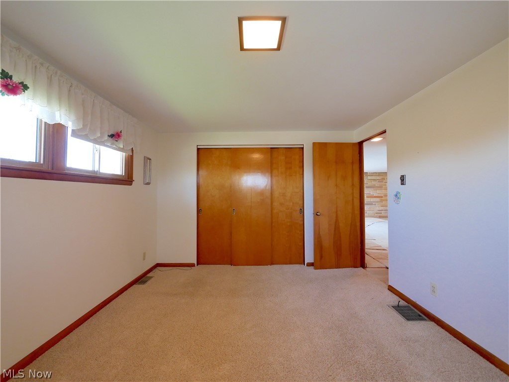 57500 Hospital Road Bellaire, OH 43906 - Photo 12 of 22 Unfurnished bedroom with light colored carpet