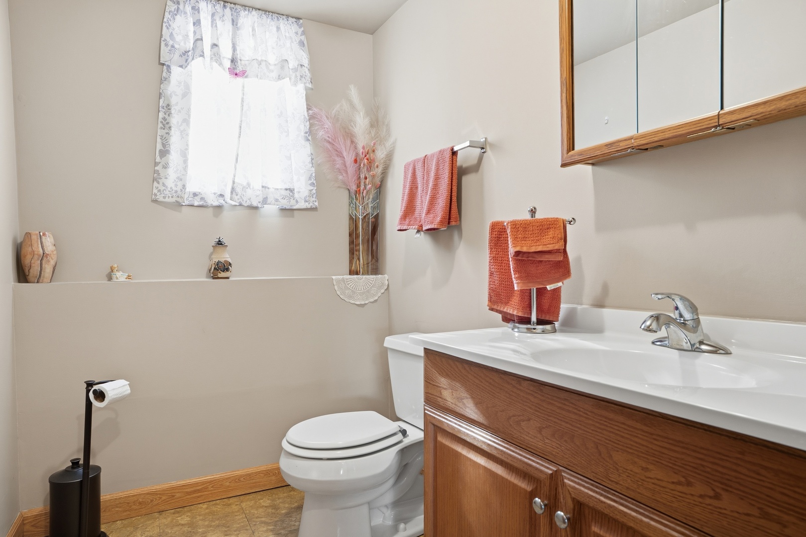 3435 218th Place Matteson, IL 60443 - Photo 12 of 19 a bathroom with a sink a toilet and mirror