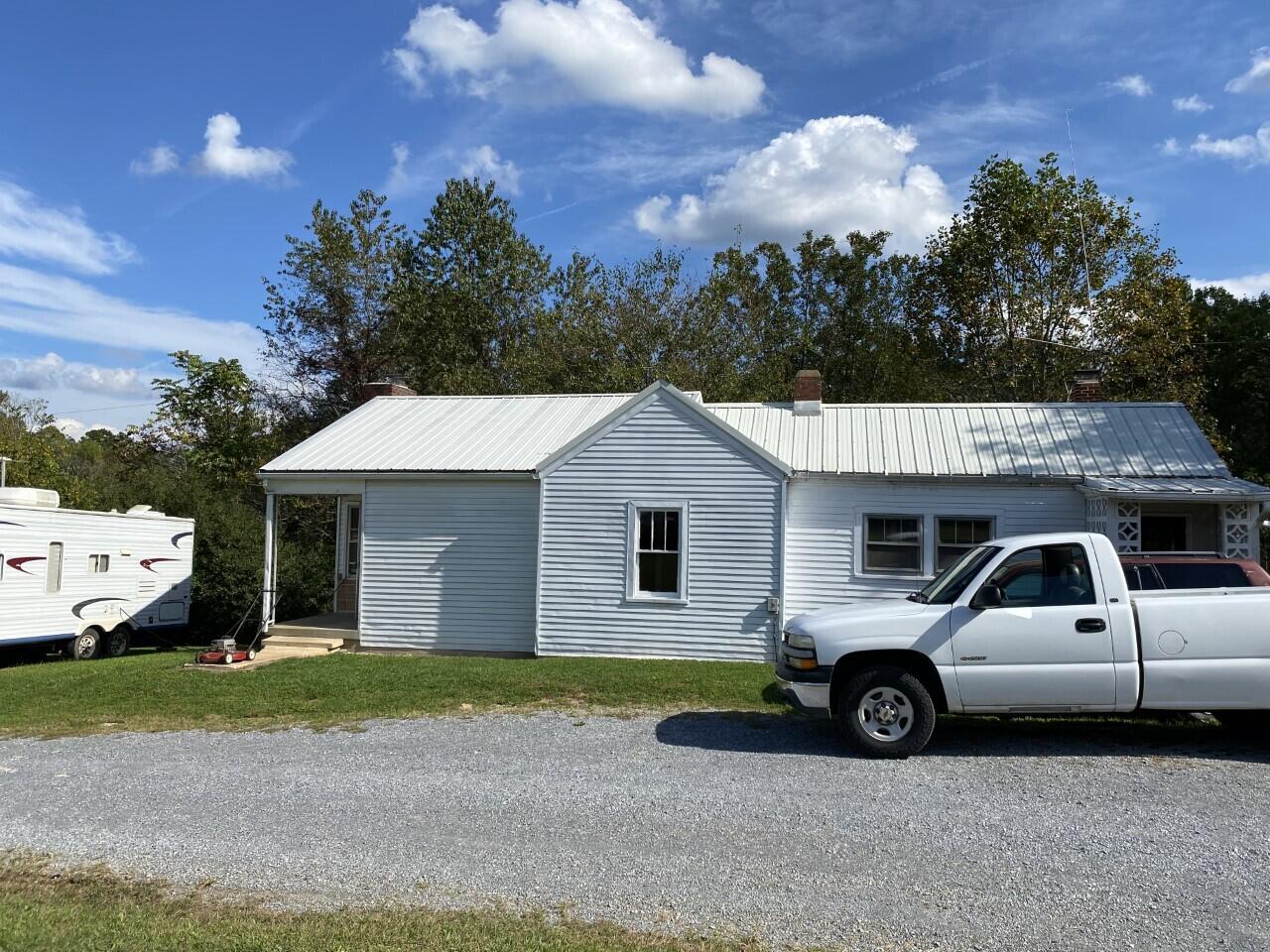 1050 Highland Road Thaxton, VA 24174 - Photo 1 of 31 a view of a white house and a yard