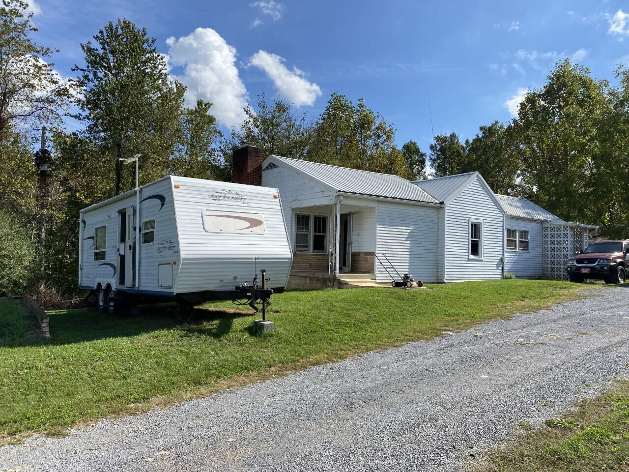 1050 Highland Road Thaxton, VA 24174 - Photo 2 of 31 a backyard of a house with table and chairs