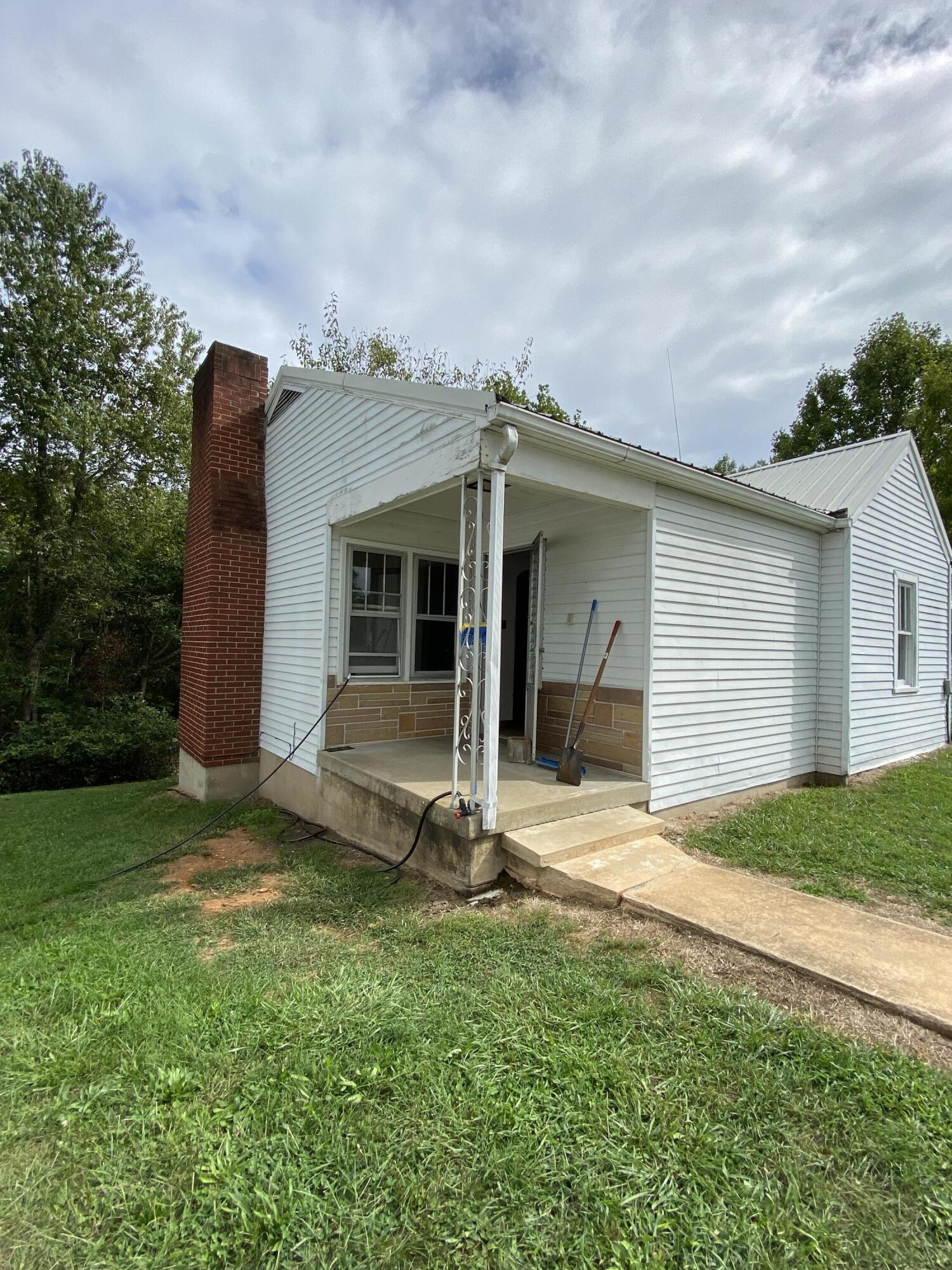 1050 Highland Road Thaxton, VA 24174 - Photo 16 of 31 a view of a house with backyard and garden