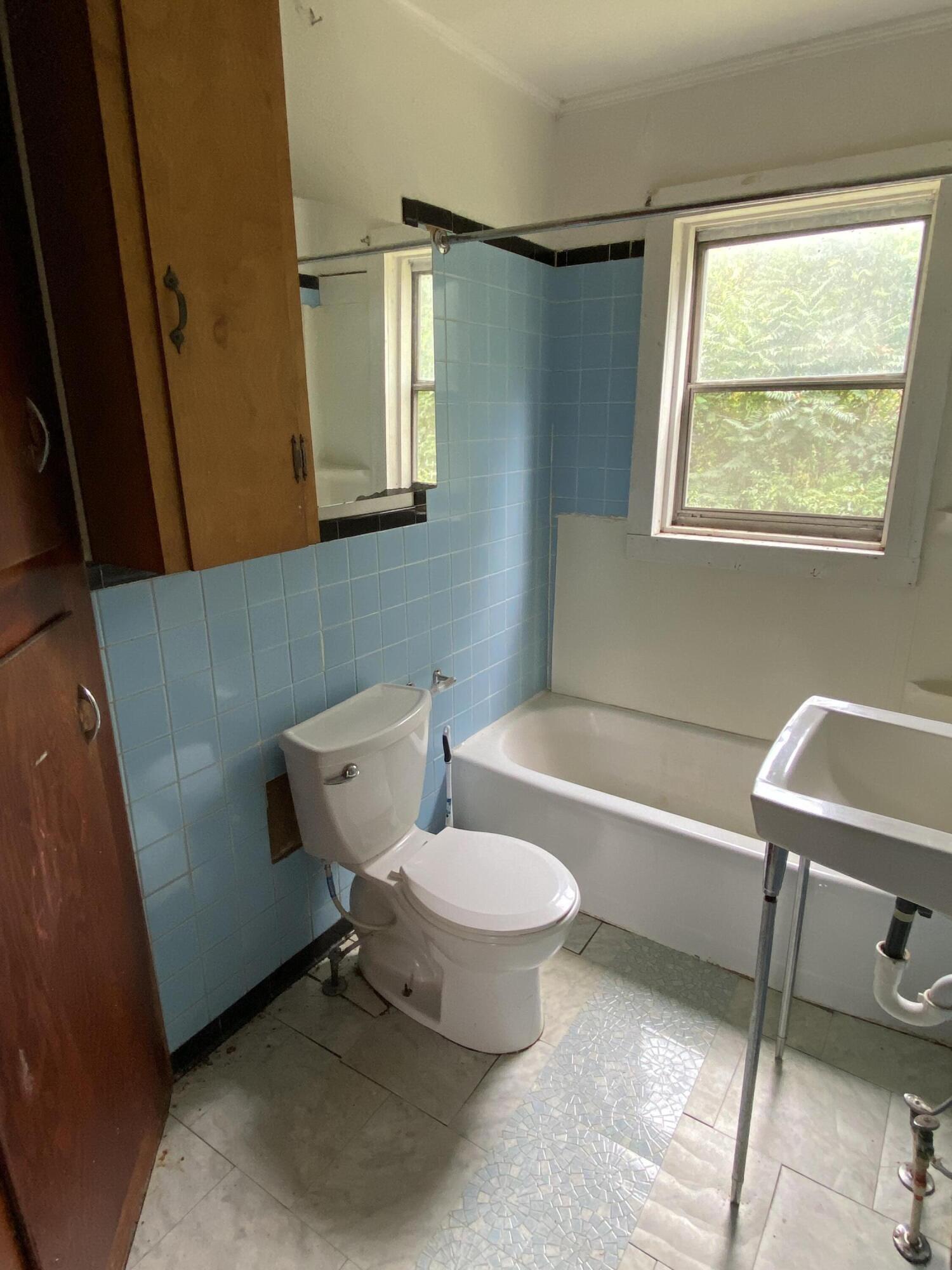 1050 Highland Road Thaxton, VA 24174 - Photo 17 of 31 a bathroom with a toilet sink and mirror