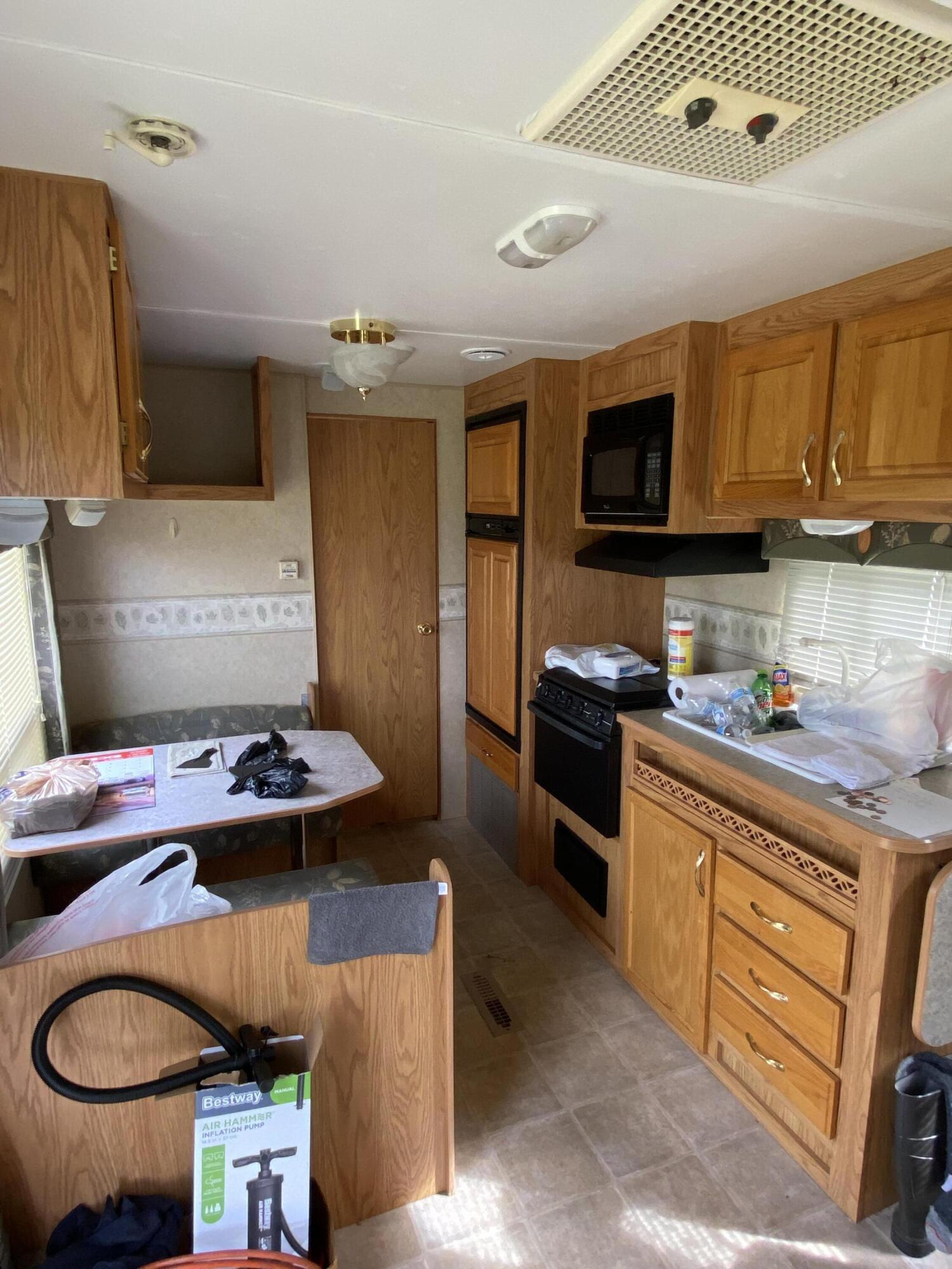1050 Highland Road Thaxton, VA 24174 - Photo 23 of 31 a kitchen with a sink stove and cabinets