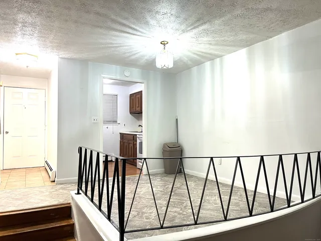 a view of a hallway with windows