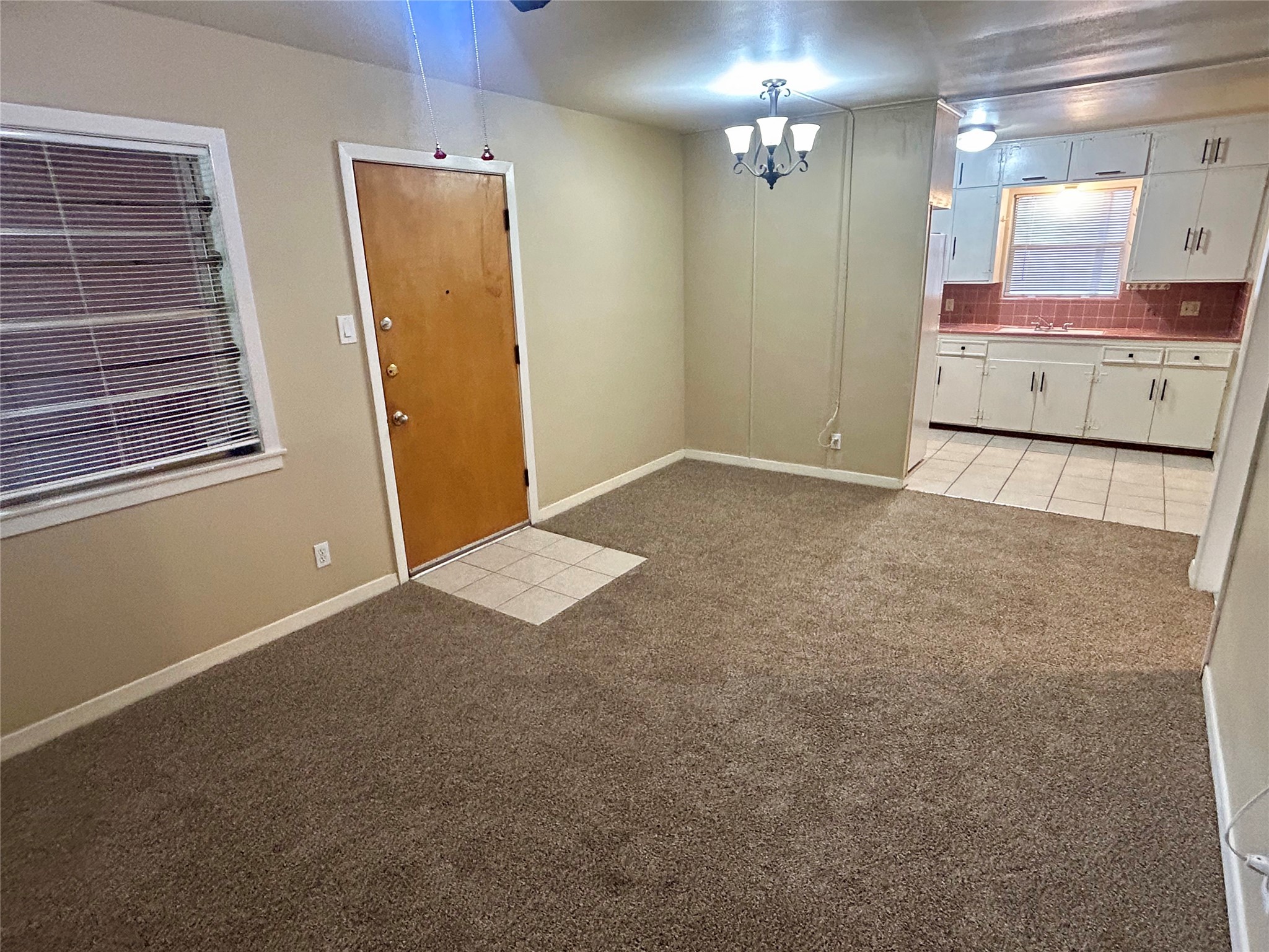 1411 Indiana Street, Unit 5 Houston, TX 77006 - Photo 4 of 14 a view of a utility room with closet and windows