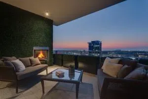 a balcony with furniture and a fireplace