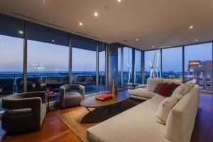 a kitchen with stainless steel appliances granite countertop a sink and a refrigerator