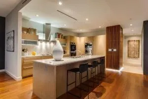 a kitchen with sink stove and cabinets