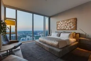 a bedroom with a bed and glass window