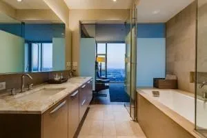 a bathroom with a tub and shower