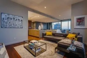 a living room with furniture and a glass door