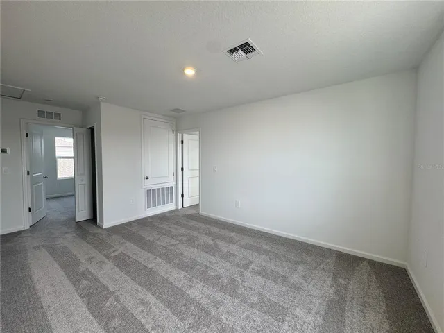 a view of a room with a hallway