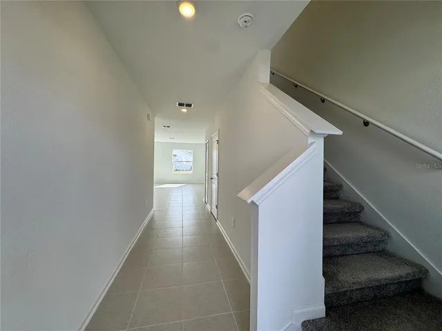 a view of hallway with stairs