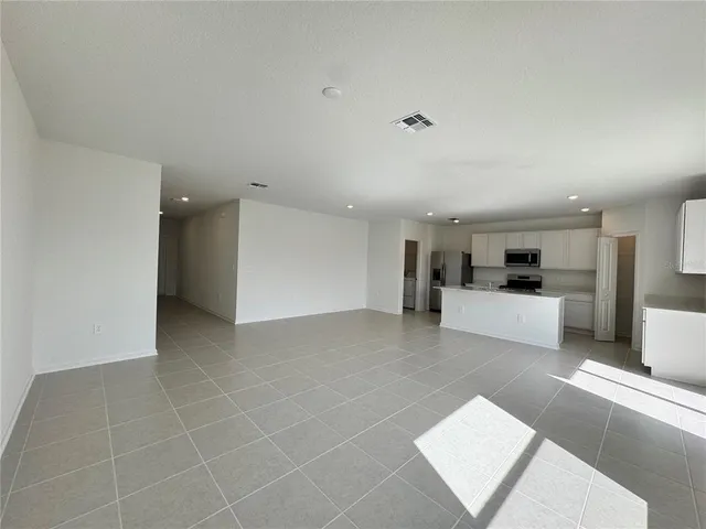 a view of a kitchen with furniture and a kitchen