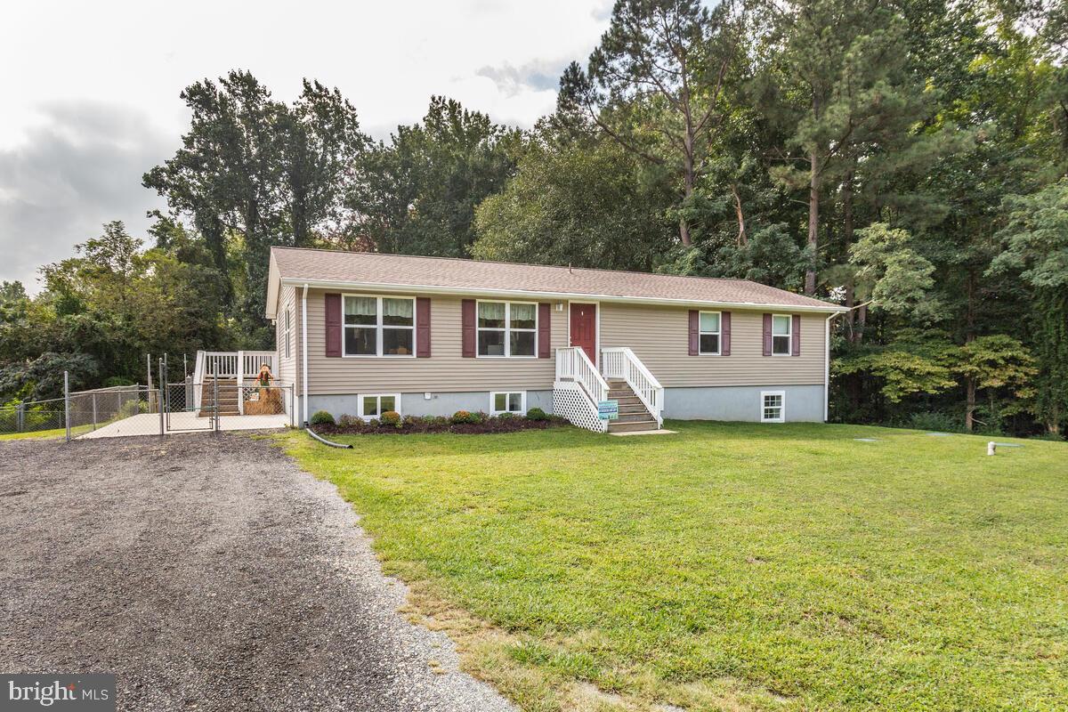 4425 Solomons Island Road Huntingtown, MD 20639 - Photo 65 of 65 a view of a house with backyard and sitting area