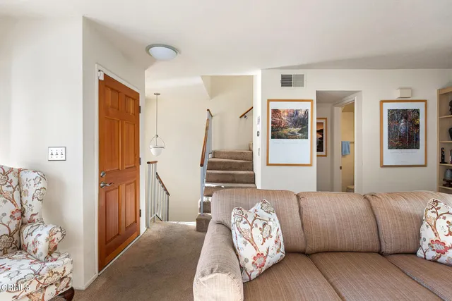 a bedroom with furniture and wooden floor