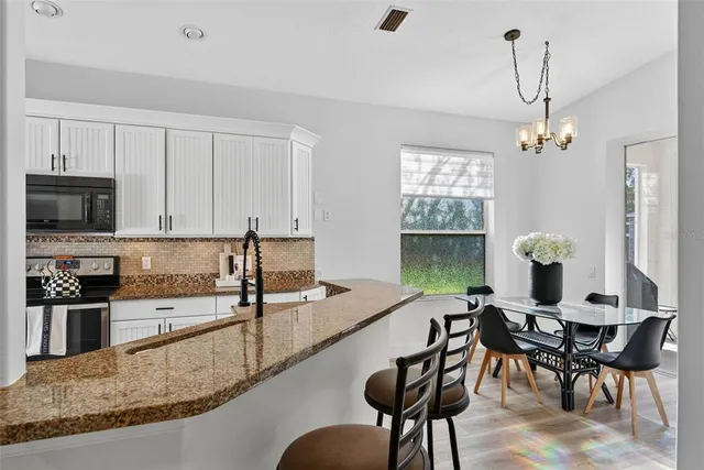 a dining room with furniture and window