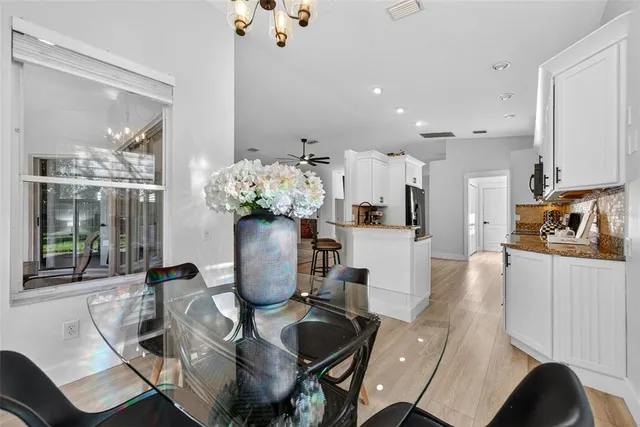 a dining room with furniture and window