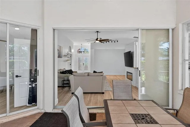 a view of a balcony with chair and the floor to ceiling window