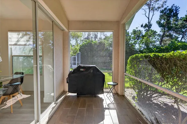 a lobby with furniture and a chandelier