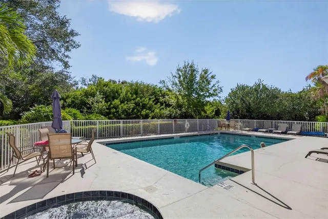 a front view of a house with a yard and a garden