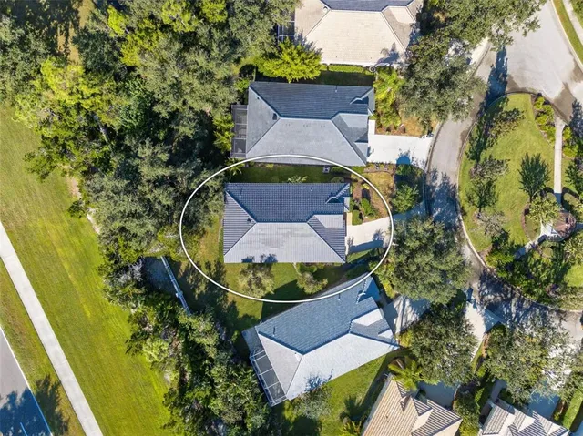 a view of a garden with sitting area and lake view