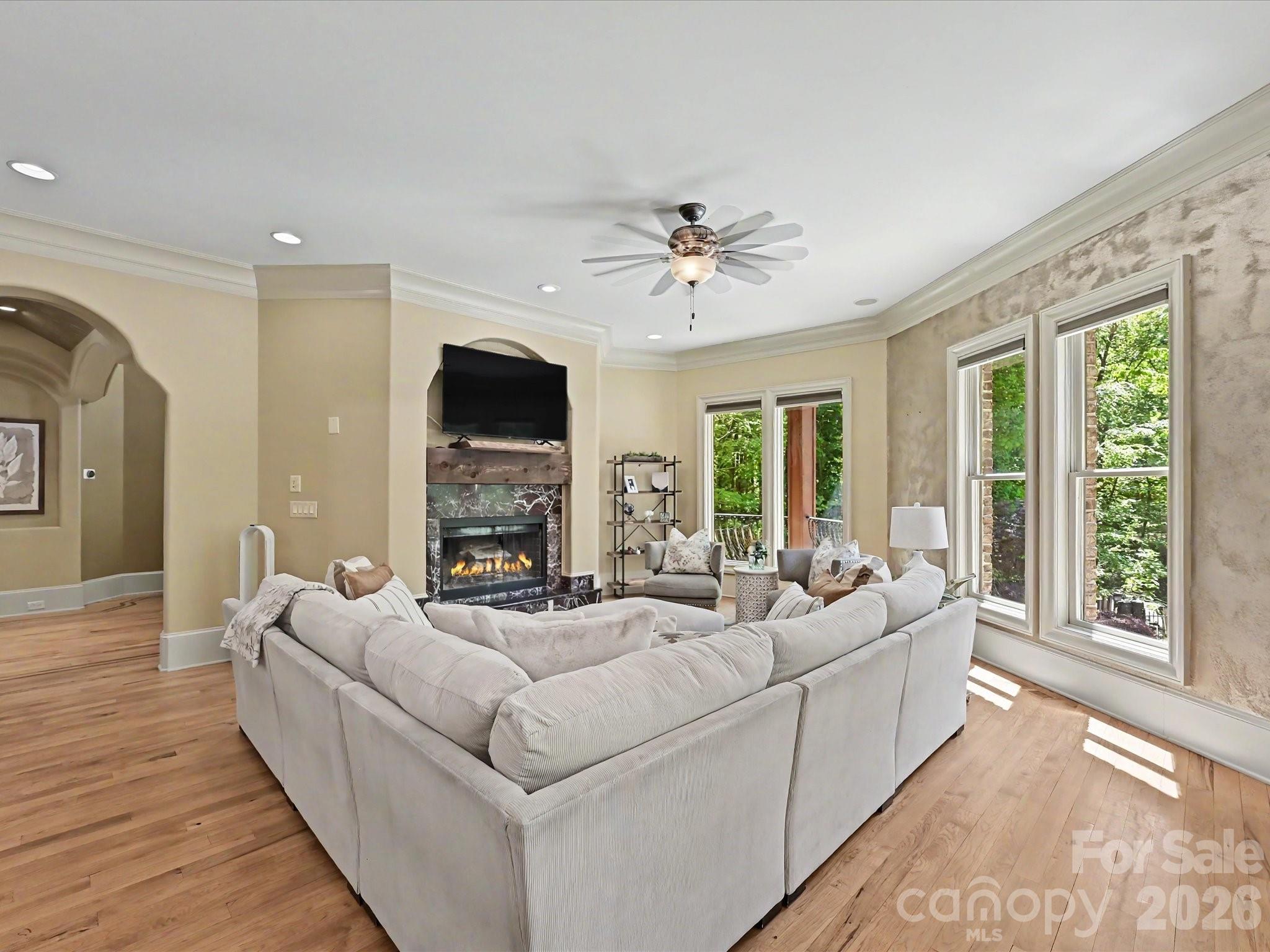 6112 Rehobeth Road Waxhaw, NC 28173 - Photo 14 of 48 a living room with fireplace furniture and a flat screen tv