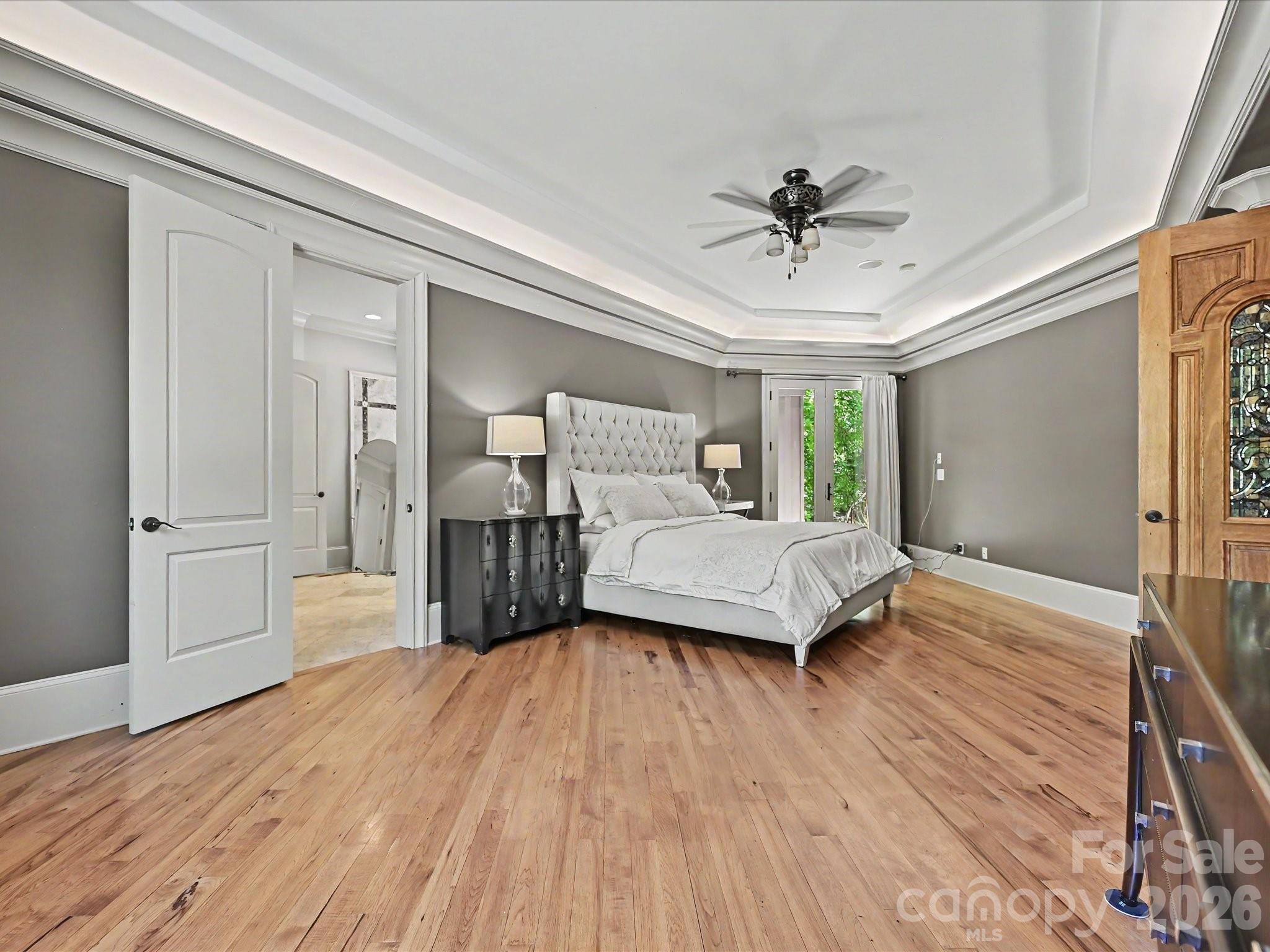 6112 Rehobeth Road Waxhaw, NC 28173 - Photo 15 of 48 a bedroom with a bed and wooden floor