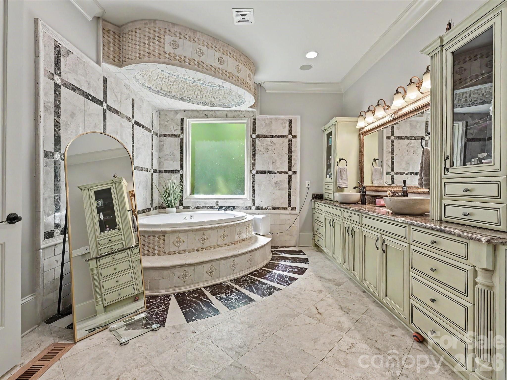 6112 Rehobeth Road Waxhaw, NC 28173 - Photo 16 of 48 a bathroom with a sink a mirror and a bathtub