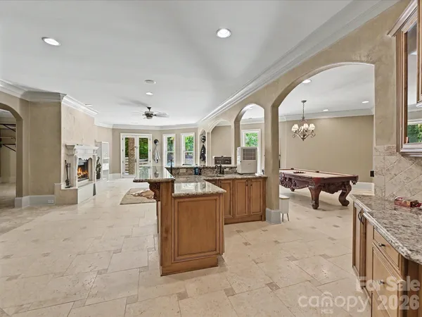 a living room with couches a table and chairs