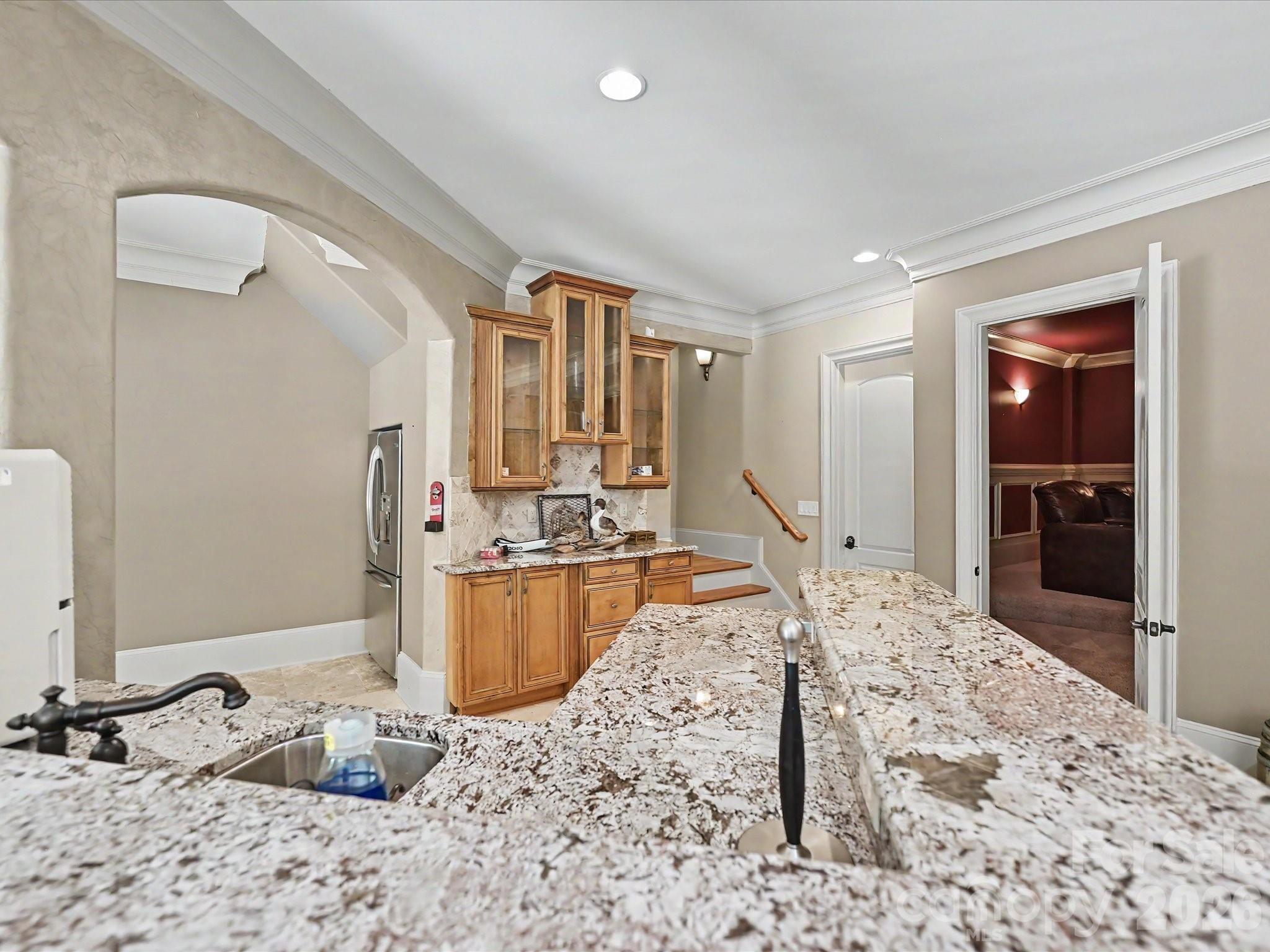 6112 Rehobeth Road Waxhaw, NC 28173 - Photo 33 of 48 a large bedroom with kitchen island sink granite counter top space and living room