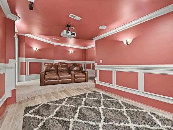 a spacious bedroom with a bed and a rug