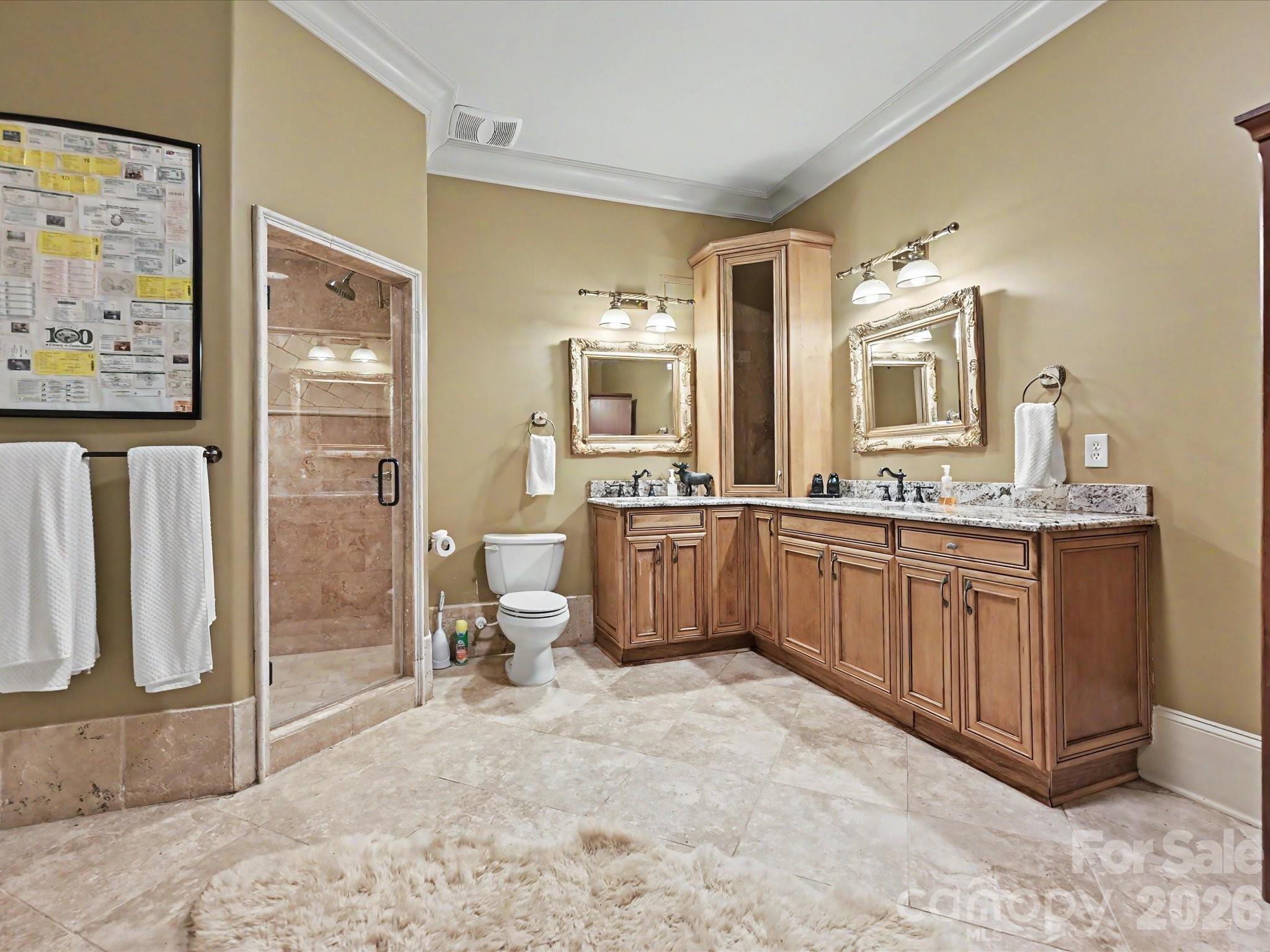 6112 Rehobeth Road Waxhaw, NC 28173 - Photo 36 of 48 a spacious bathroom with a double vanity sink a mirror and a bathtub