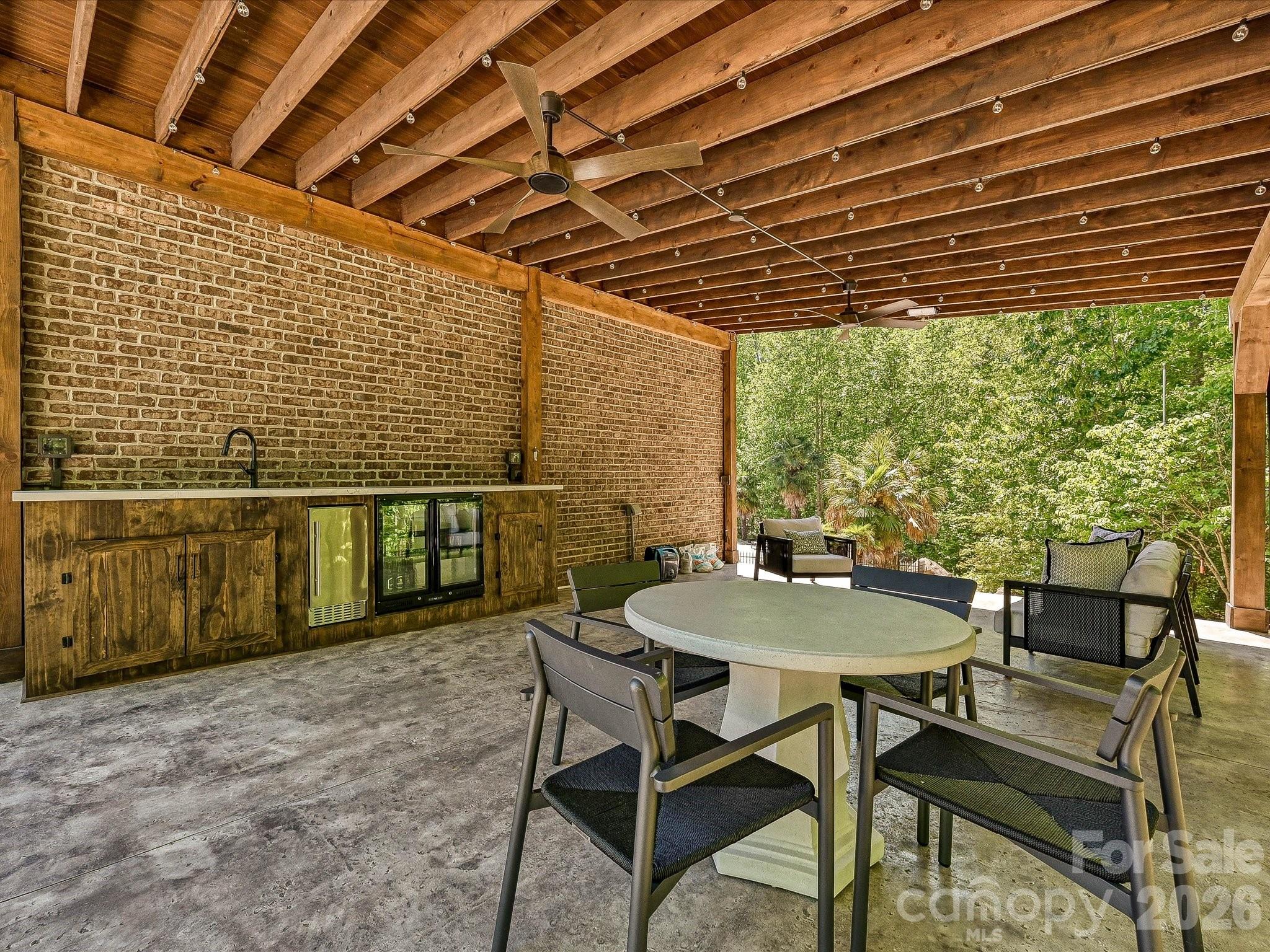 6112 Rehobeth Road Waxhaw, NC 28173 - Photo 38 of 48 a balcony with table and chairs