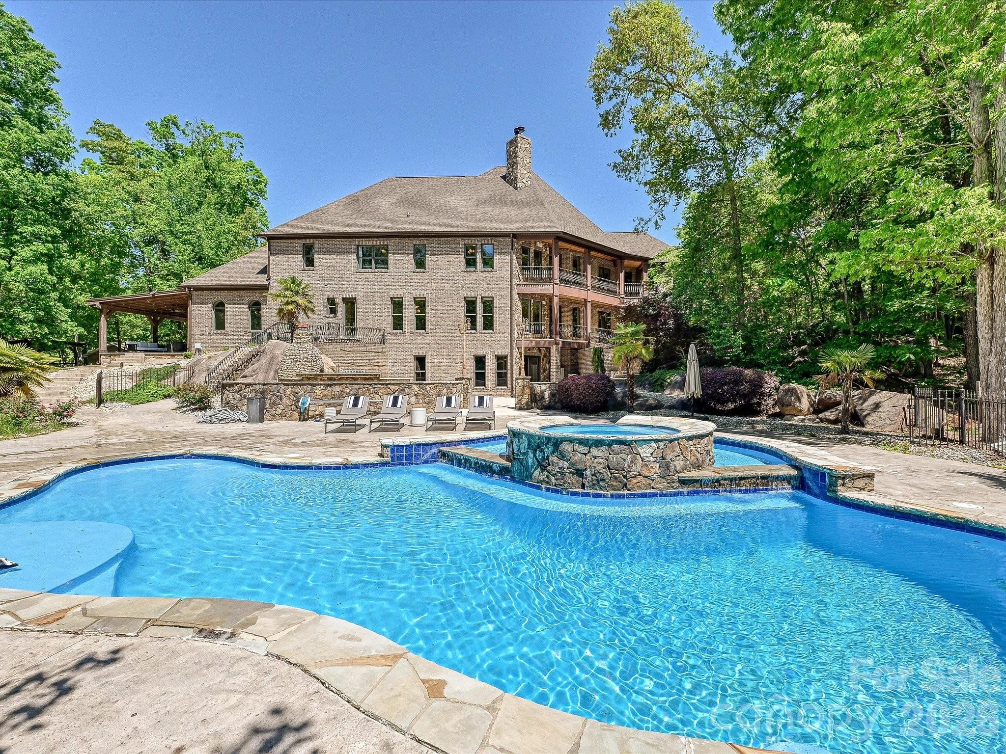 6112 Rehobeth Road Waxhaw, NC 28173 - Photo 43 of 48 a view of a house with swimming pool and sitting area