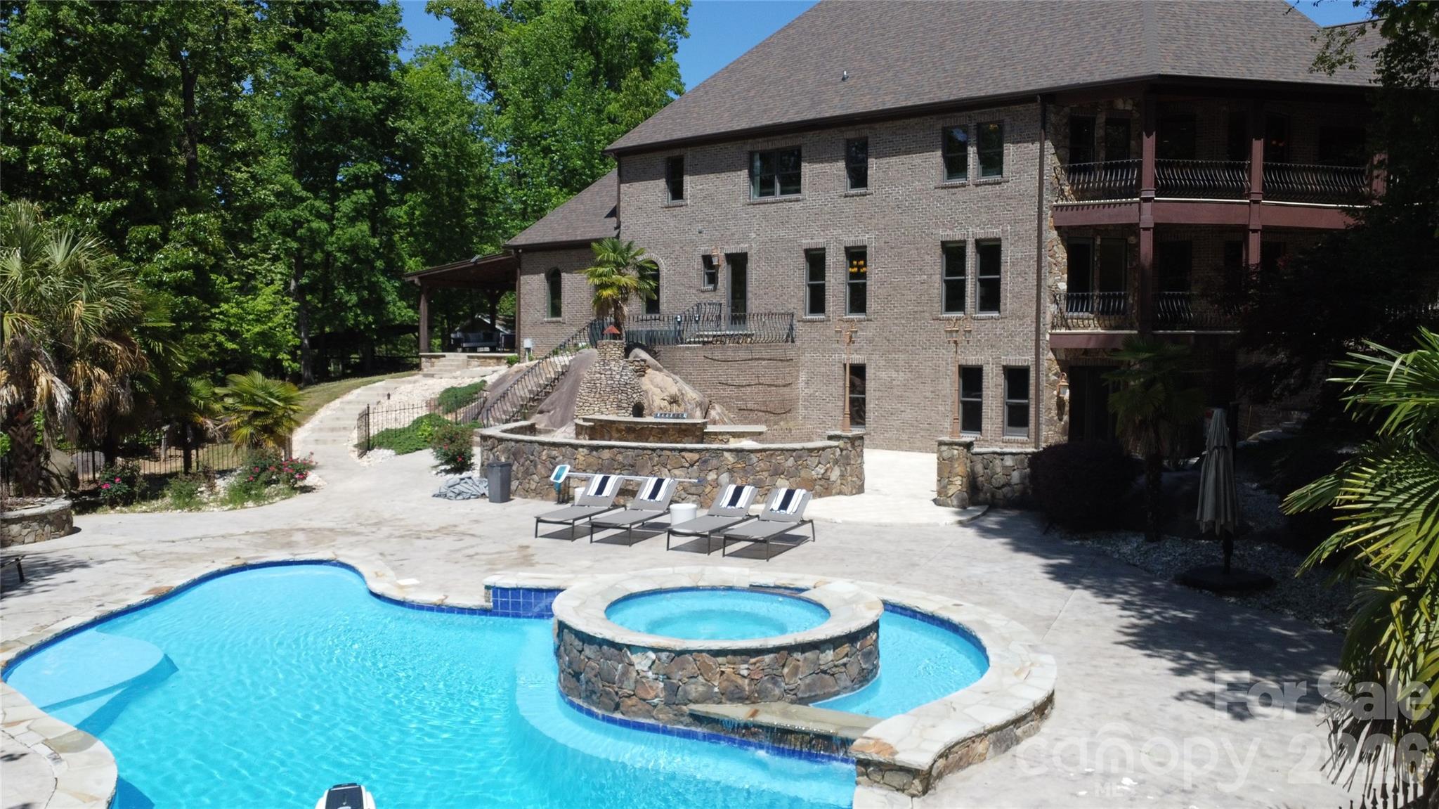 6112 Rehobeth Road Waxhaw, NC 28173 - Photo 44 of 48 a view of a house with backyard water fountain and sitting area