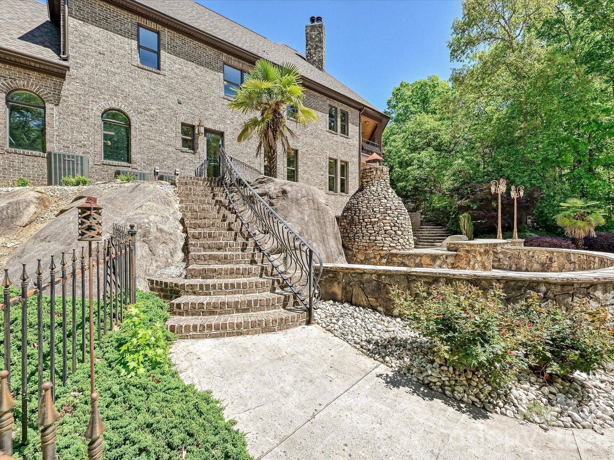 6112 Rehobeth Road Waxhaw, NC 28173 - Photo 45 of 48 a front view of a house with a garden