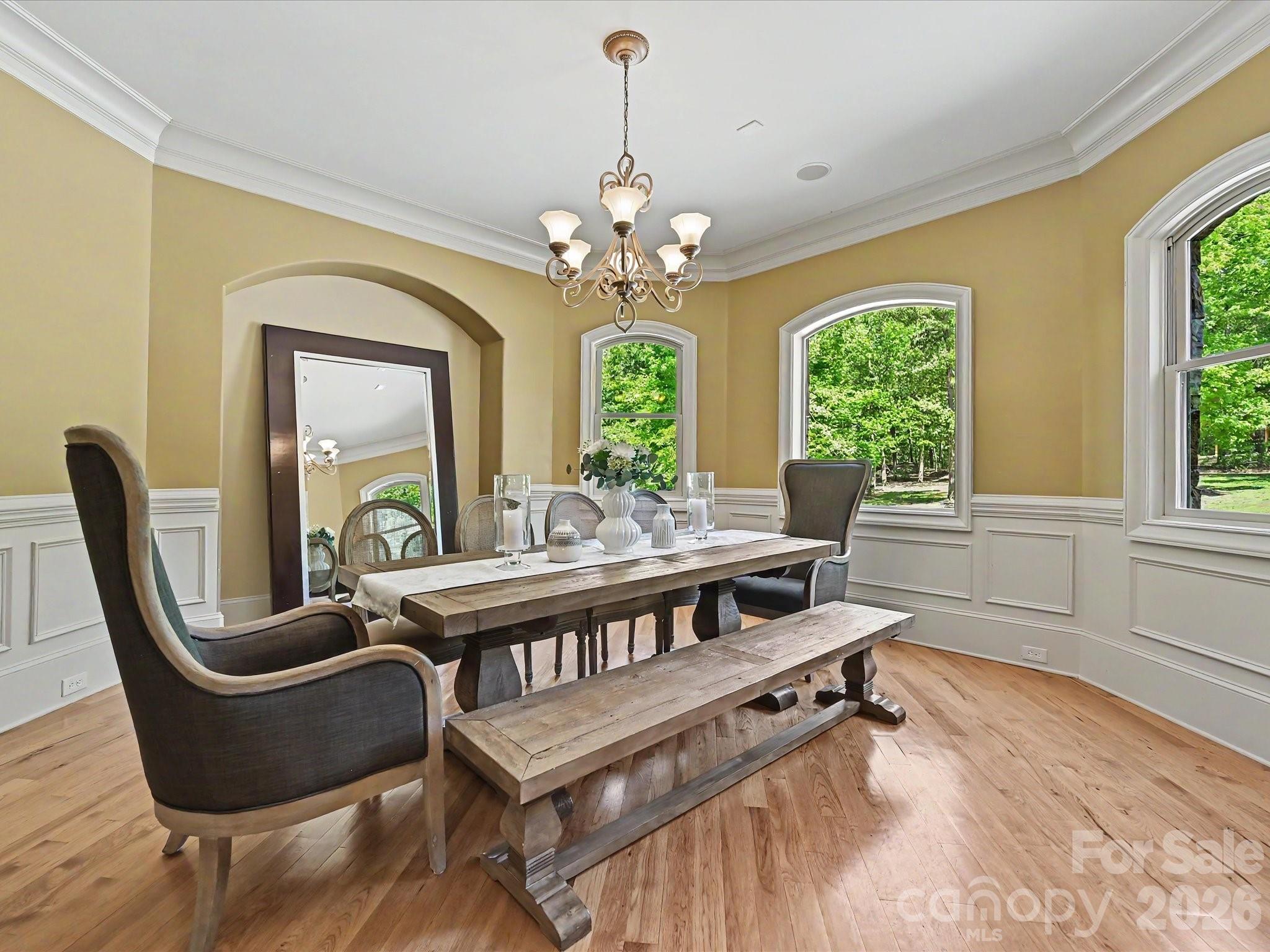 6112 Rehobeth Road Waxhaw, NC 28173 - Photo 9 of 48 a living room with furniture a window and a chandelier