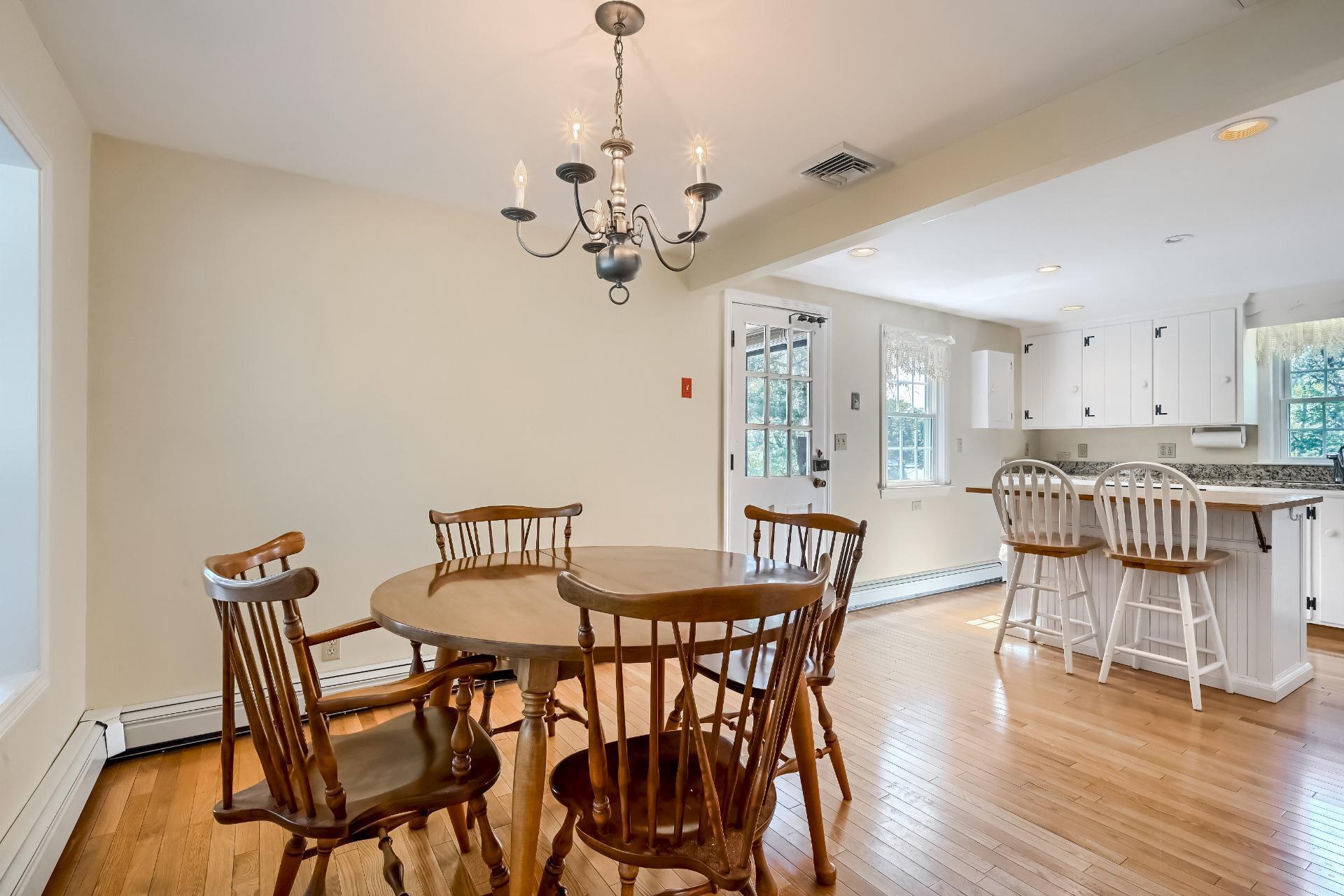 7 Ebb Road Yarmouth Port, MA 02675 - Photo 8 of 52 a view of a dining room with furniture and wooden floor