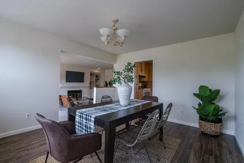 a view of a dining room with furniture window and wooden floor