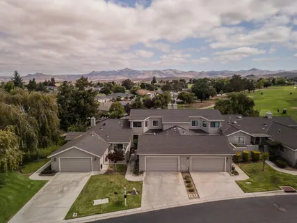 an aerial view of a house with a garden