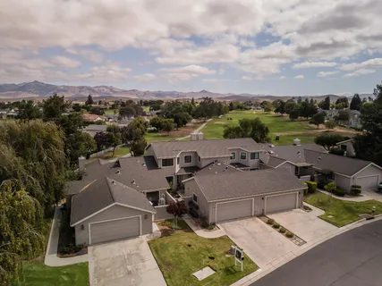 an aerial view of a house with a garden