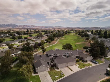 an aerial view of residential house with outdoor space