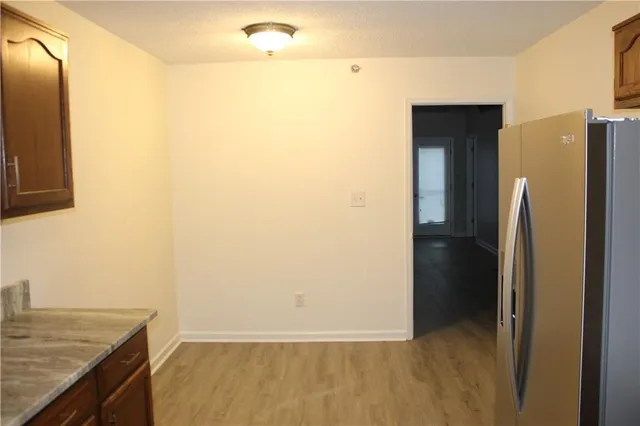 a view of a kitchen from the hallway