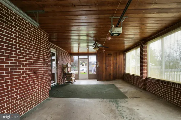a view of a room with wooden walls