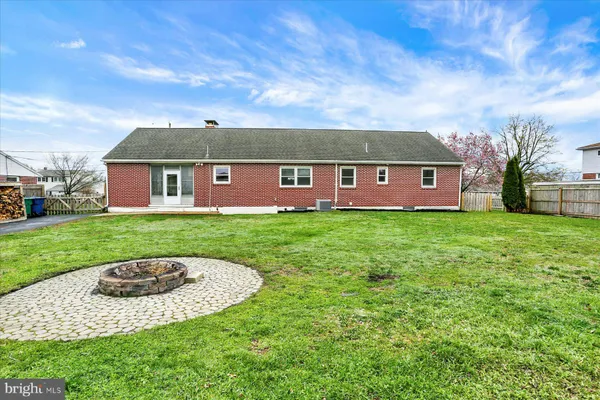 a front view of house with yard and entertaining space
