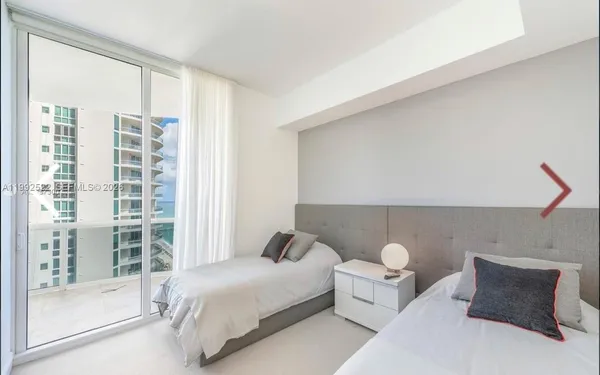 a bathroom with a sink mirror vanity and toilet