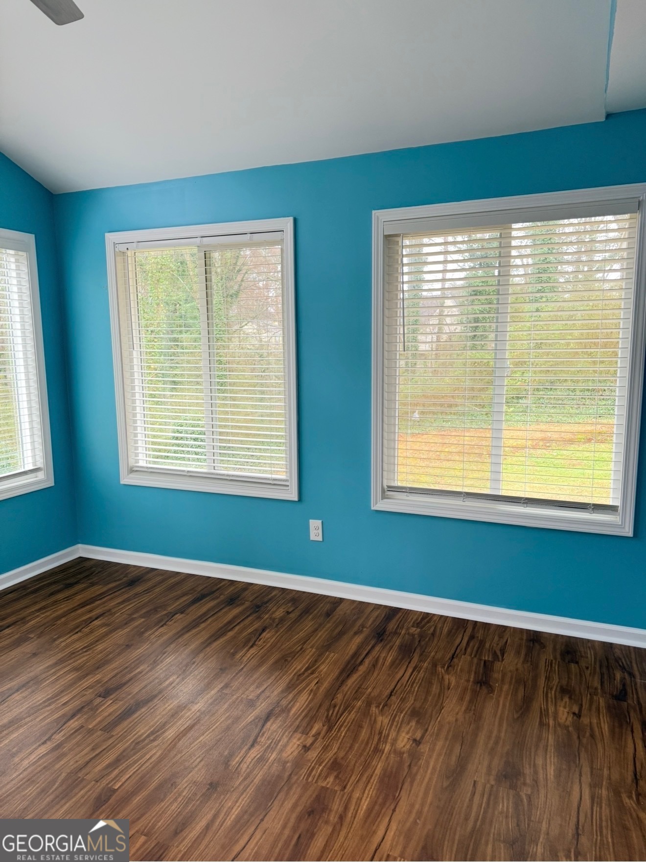 4144 Pinehurst Valley Drive Decatur, GA 30034 - Photo 11 of 31 a view of an empty room with wooden floor and a window