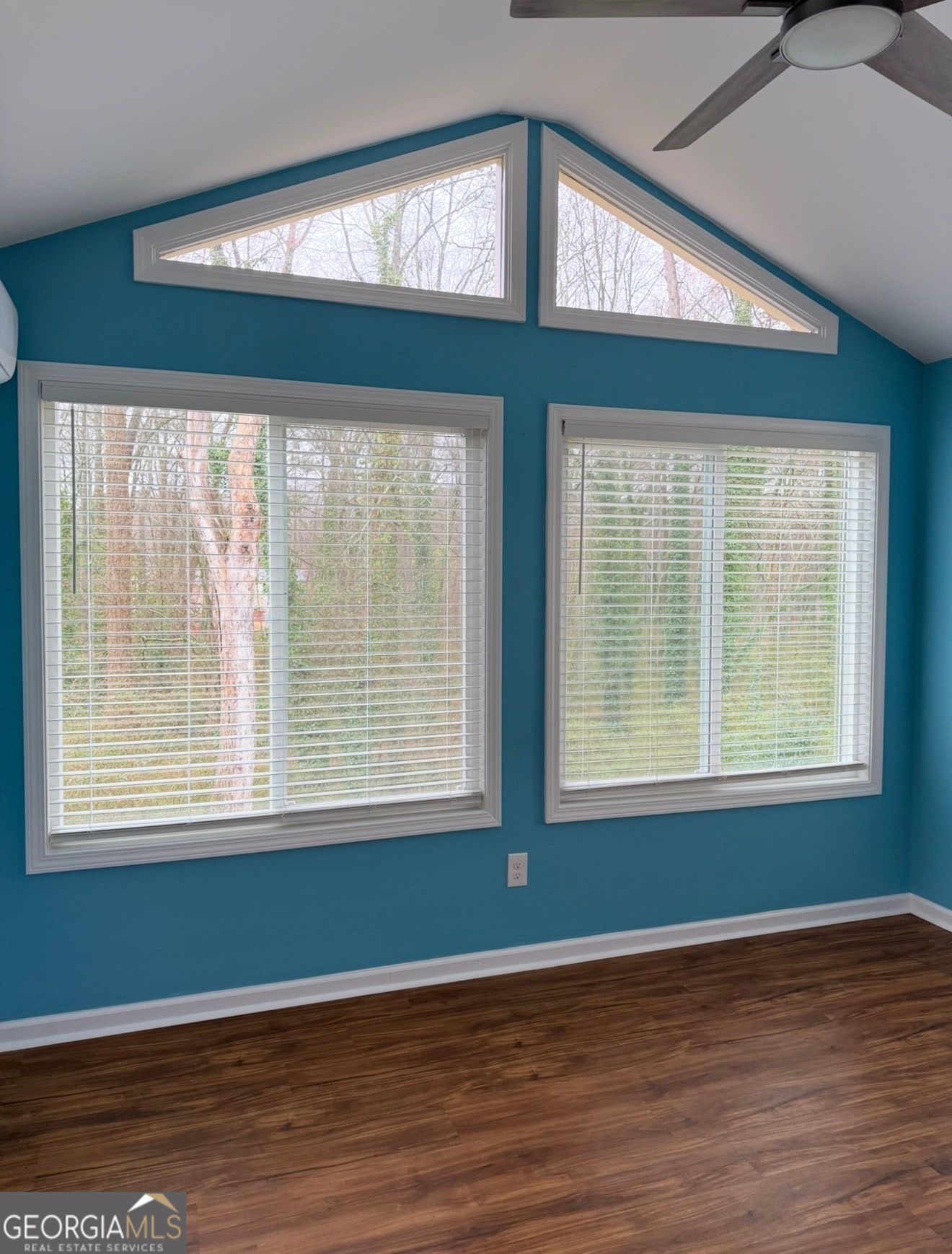 4144 Pinehurst Valley Drive Decatur, GA 30034 - Photo 13 of 31 a view of an empty room with wooden floor and a window
