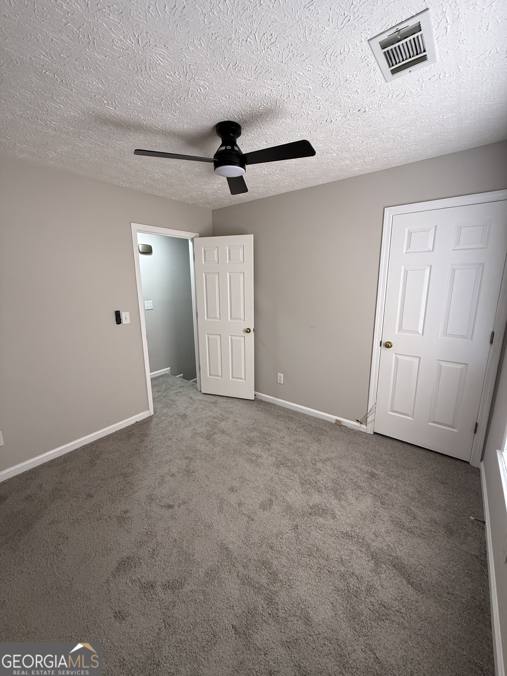 4144 Pinehurst Valley Drive Decatur, GA 30034 - Photo 20 of 31 an empty room with a ceiling fan and window